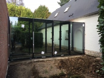 Extension d’une villa – Piscine couverte avec patio vitré – MUR RIDEAU